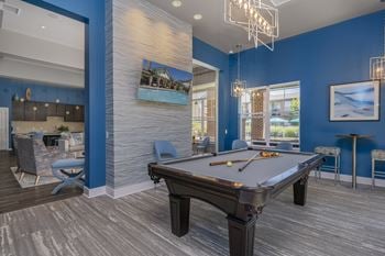 Clubhouse with executive business center, gathering space, and game room with billiards